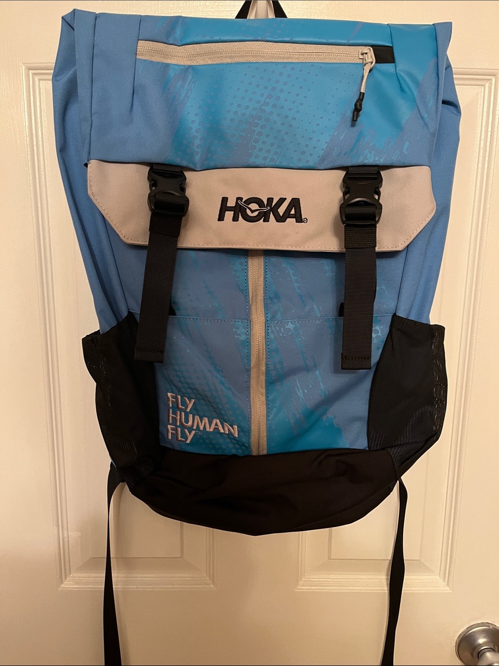 Hoka Light Blue and Black Roll-Top Backpack with Front Buckles